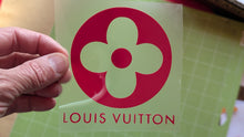 Load image into Gallery viewer, Louis Vuitton logo on a green card held by a hand